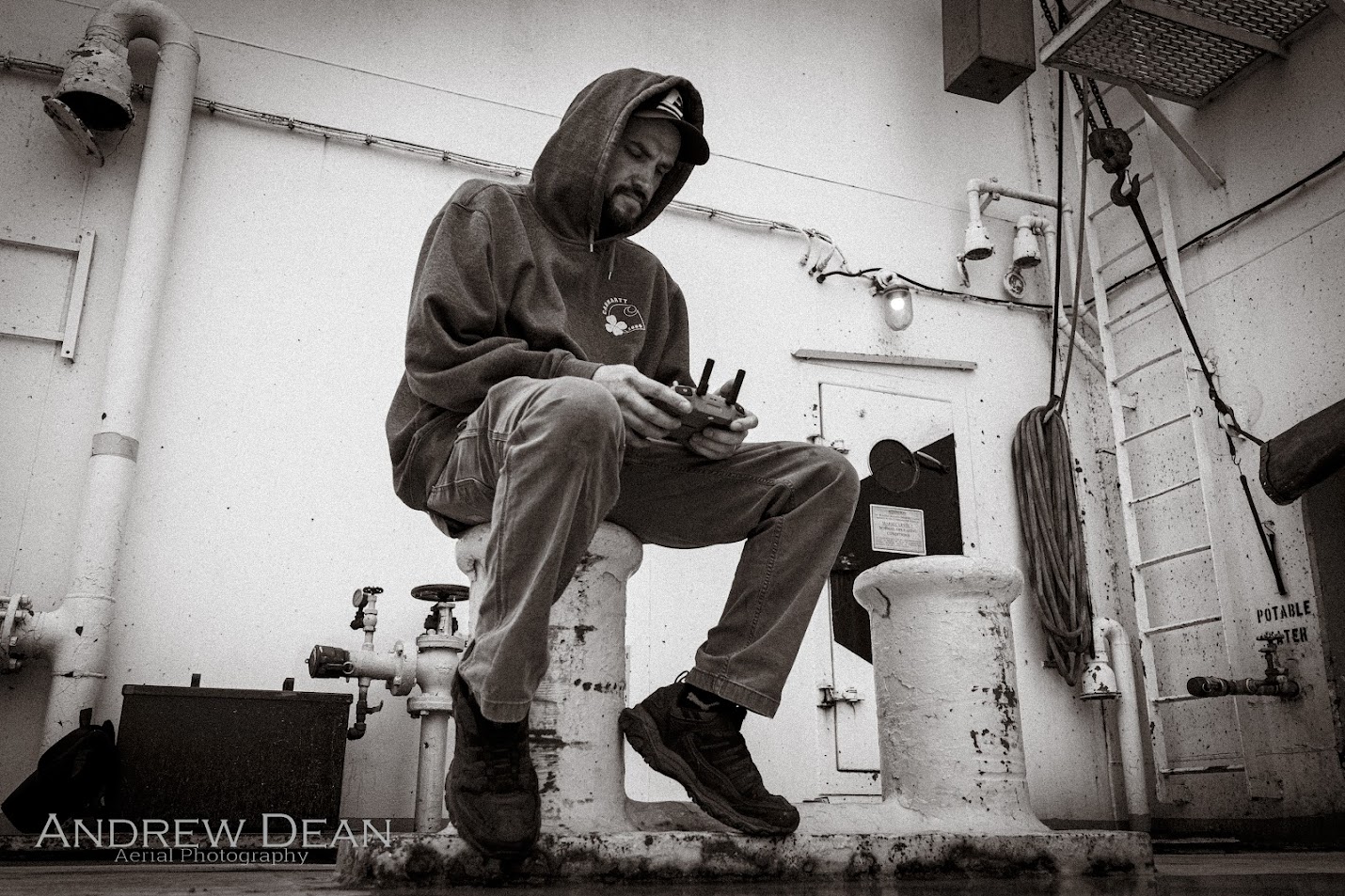 Andrew Dean operating a drone from aboard a Great Lakes vessel