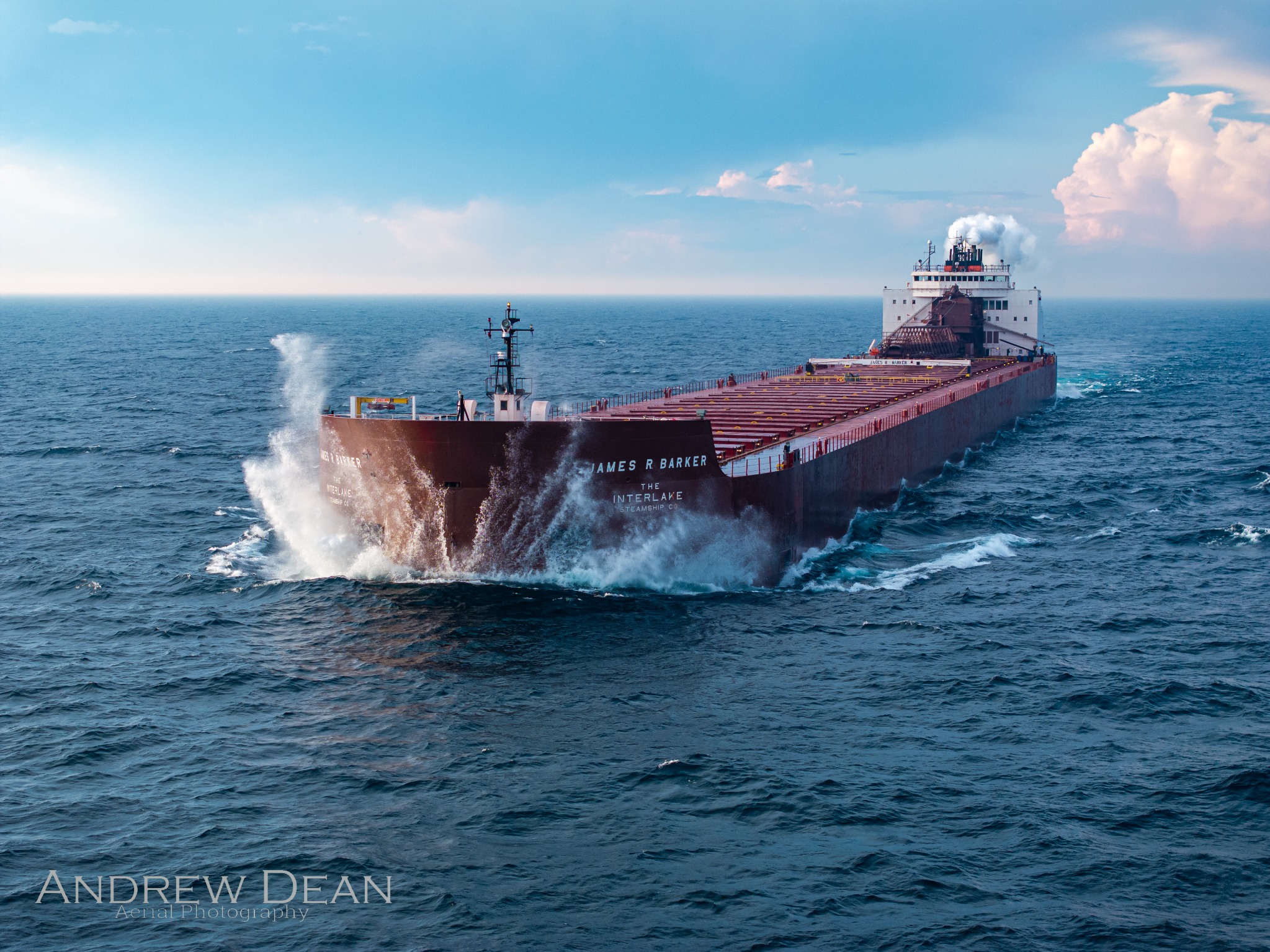 James R. Barker underway on the open Great Lakes with waves breaking across the bow