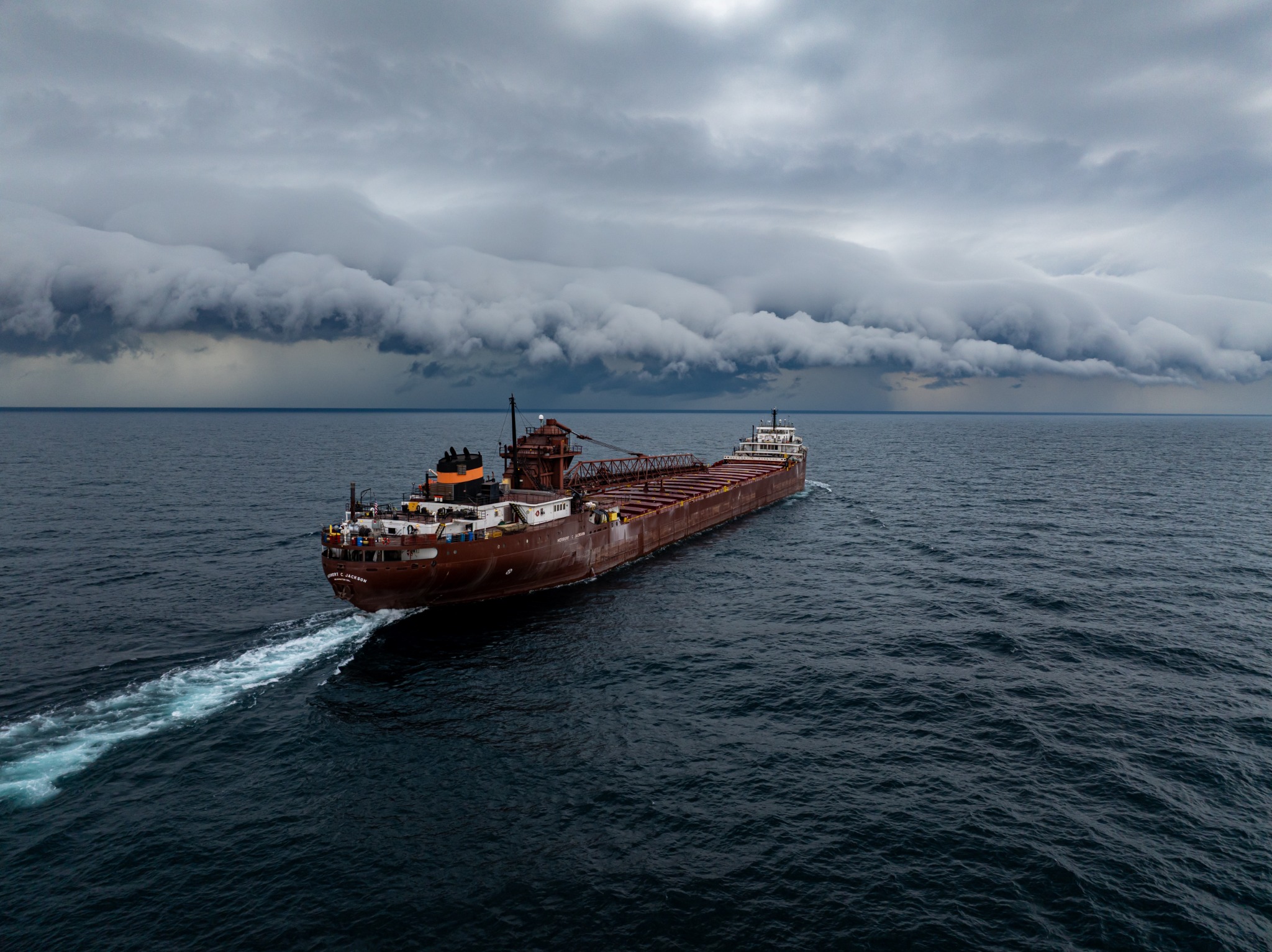 Herbert C. Jackson underway beneath an approaching shelf cloud on the Great Lakes